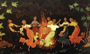 women dancing around a fire